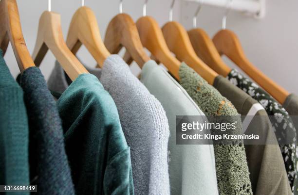 green clothes - clothes wardrobe stock-fotos und bilder