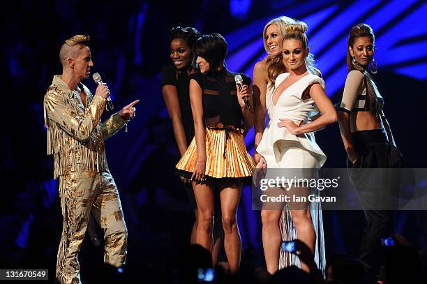 Fashion designer Jeremy Scott and Daisy Evans, Ashley Shaw, Chelsey Reynolds, Monique Roberts, Seyi Odedere of girl group From Above onstage during...