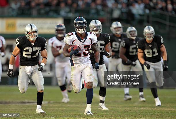 Willis McGahee of the Denver Broncos runs the ball in for a touchdown against the Oakland Raiders at O.co Coliseum on November 6, 2011 in Oakland,...