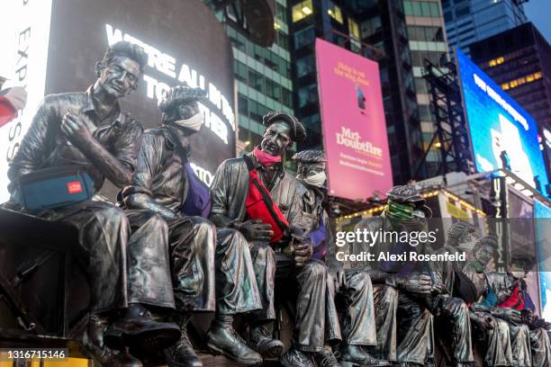 Truck advertising Manhattan Portage bags with a sculpture inspired by the Charles Clyde Ebbets photograph, 'Lunch Atop A Skyscraper' rides through...