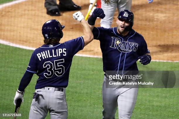 Mike Zunino of the Tampa Bay Rays celebrates his home run with Brett Phillips during the seventh inning against the Los Angeles Angels at Angel...