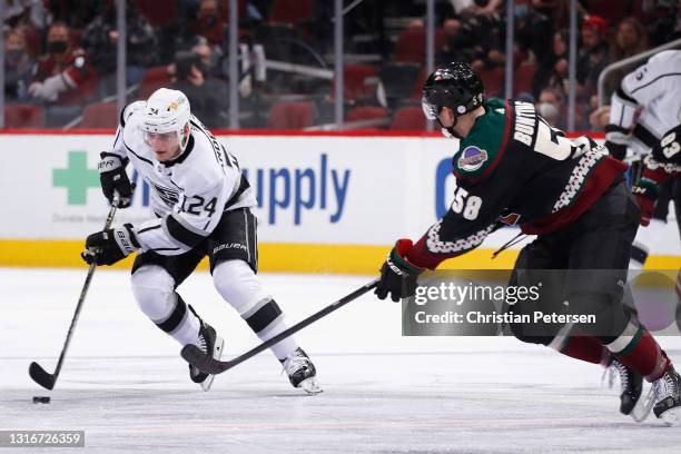 Lias Andersson of the Los Angeles Kings skates with the puck against the Arizona Coyotes during the NHL game at Gila River Arena on May 05, 2021 in...