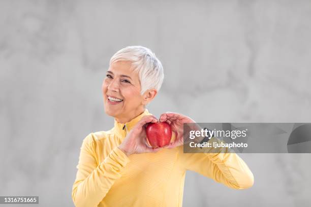 it's not about eating less, it's about eating right - apple heart stock pictures, royalty-free photos & images