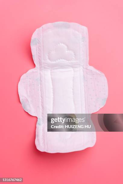 close up of woman's sanitary pad on pink - sanitary napkins stock pictures, royalty-free photos & images