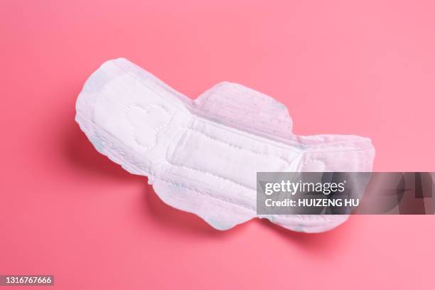 close up of woman's sanitary pad on pink - sanitary napkins stock pictures, royalty-free photos & images