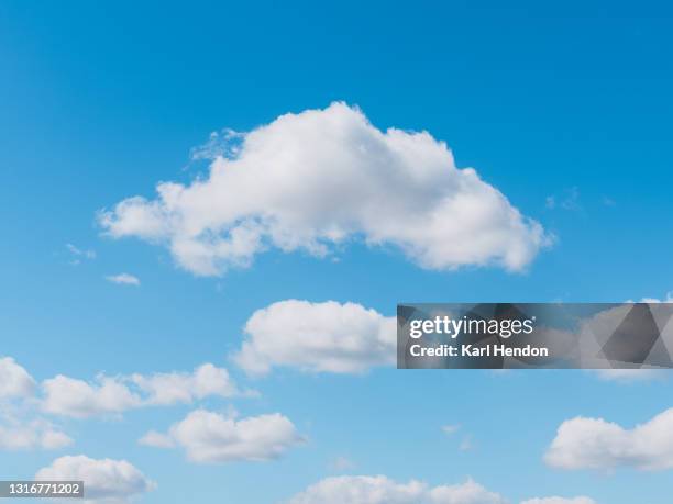 a daytime view of clouds and blue sky - stock photo - cumulus stockfoto's en -beelden