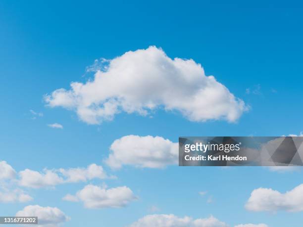 a daytime view of clouds and blue sky - stock photo - nuvens fofas imagens e fotografias de stock