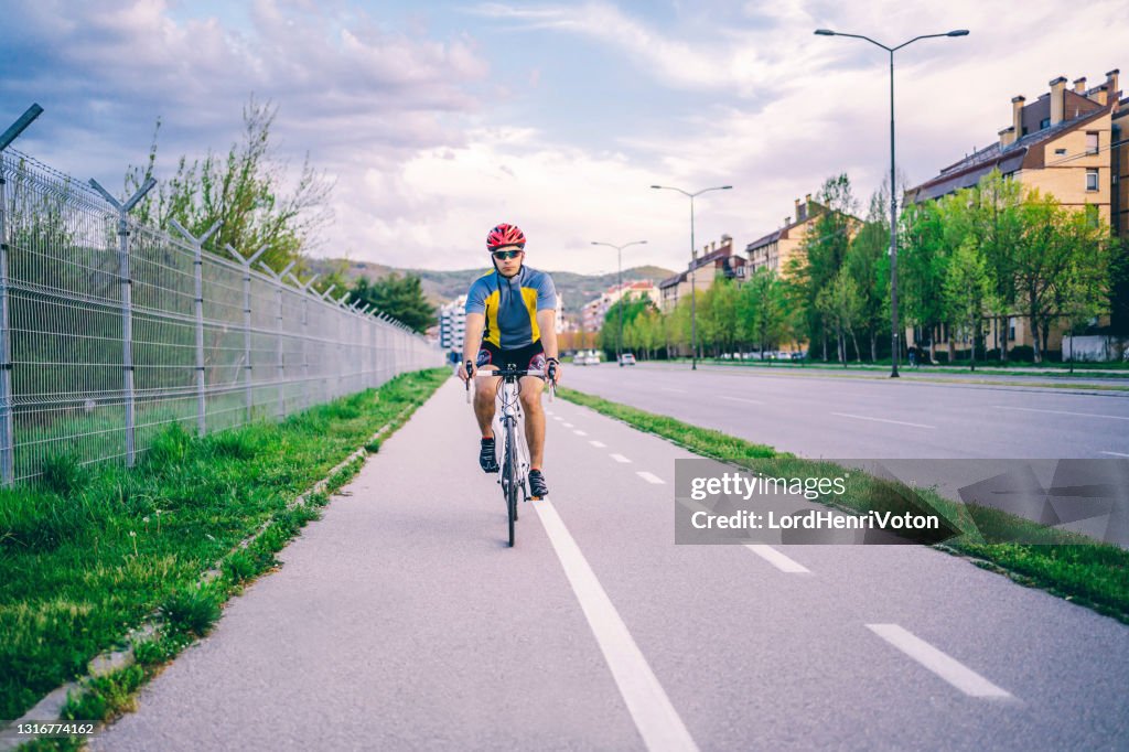 Man Riding Raser Bike Man Riding Racing Bicycle High-Res Stock Photo - Getty Images