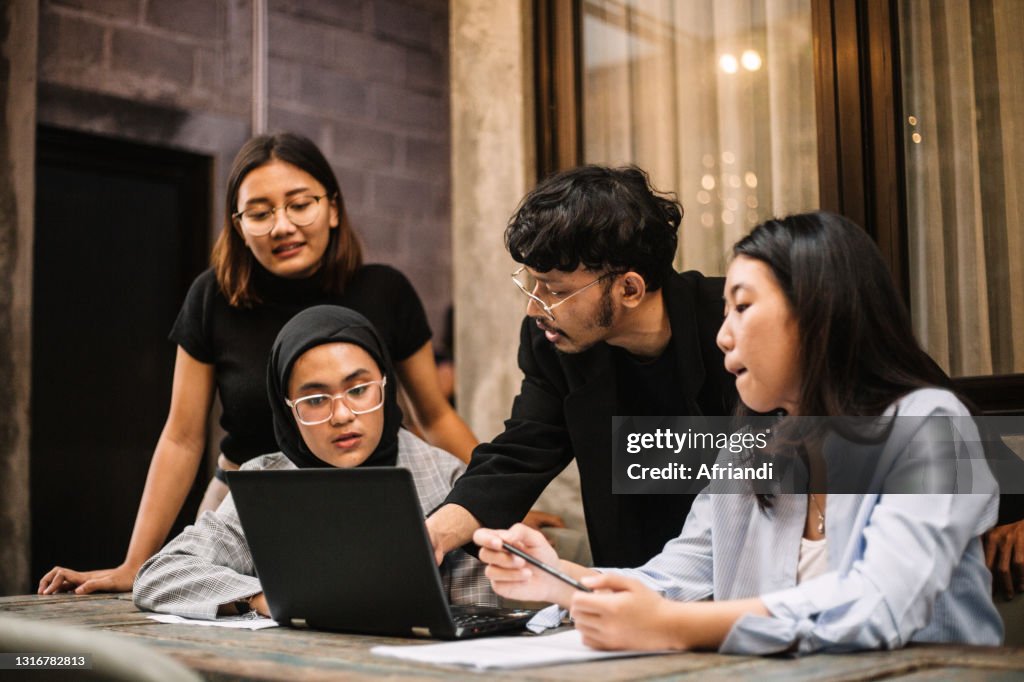 Meeting of young professionals in a co-working space