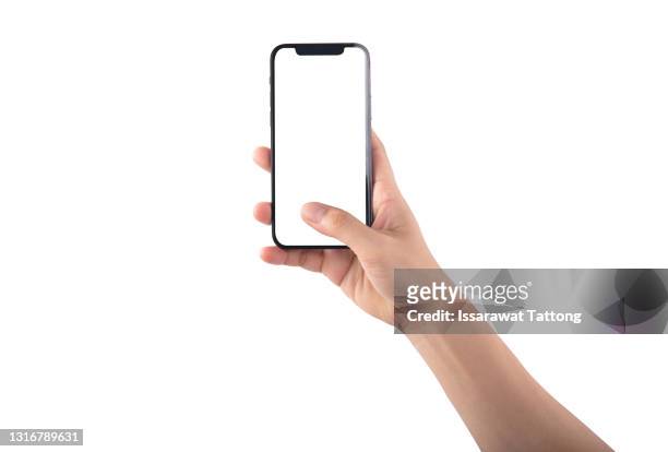 close up hand hold phone isolated on white background - hand stock-fotos und bilder