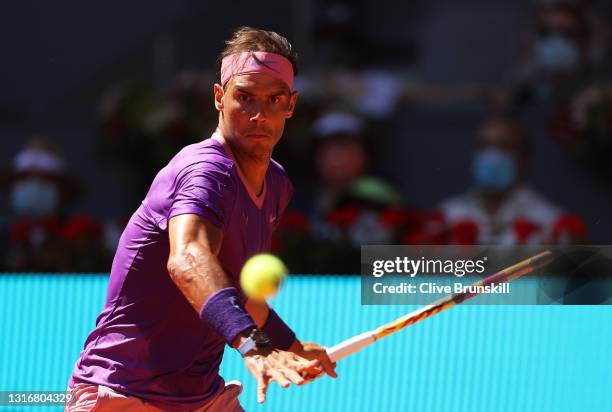 Rafael Nadal of Spain plays a forehand shot during their Quarter Final match against Alexander Zverev of Germany during Day Nine of the Mutua Madrid...