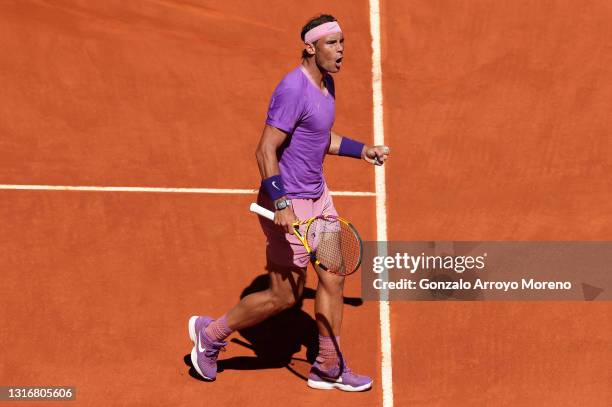 Rafael Nadal of Spain celebrates a point during their Quarter Final match against Alexander Zverev of Germany during Day Nine of the Mutua Madrid...