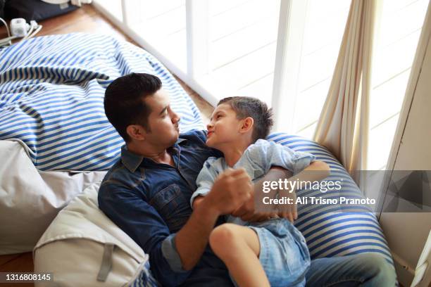 father is playing with his son - fashionable dad stock pictures, royalty-free photos & images