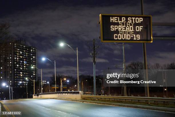 covid-19 traffic sign - toronto sign stock pictures, royalty-free photos & images