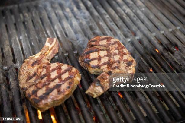beef steak on a griddle - griddle stock pictures, royalty-free photos & images