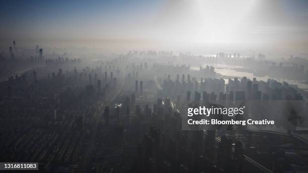morning haze covers the wuhan skyline - skog stock pictures, royalty-free photos & images