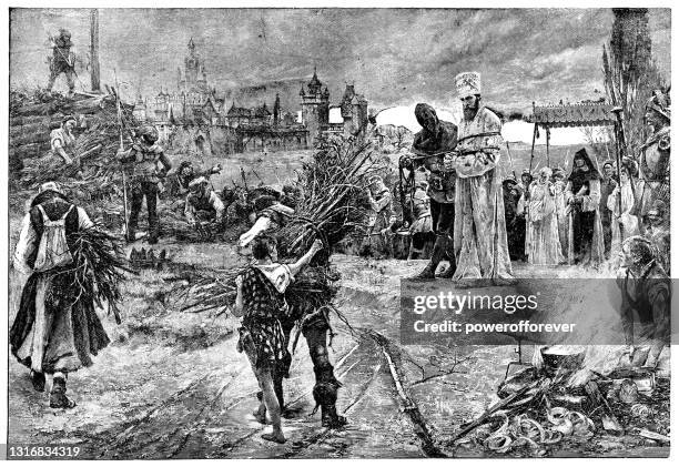 protestant martyr about to be burned at the stake in england - 16th century - 16th century stock illustrations
