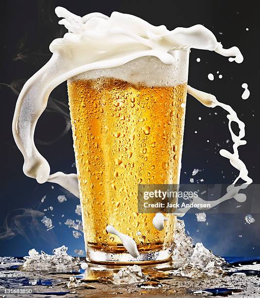 beer glass with foam - beer splashing stock pictures, royalty-free photos & images