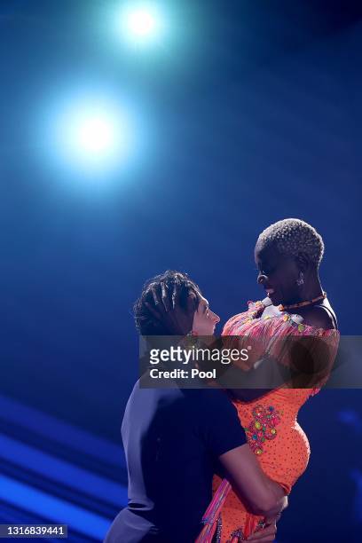 Auma Obama and Andrzej Cibis perform on stage during the 9th show of the 14th season of the television competition "Let's Dance" on May 07, 2021 in...