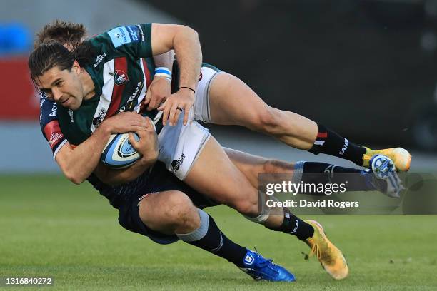 Kobus Van Wyk of Leicester is tackled by AJ MacGinty of Sale during the Gallagher Premiership Rugby match between Sale and Leicester Tigers at AJ...