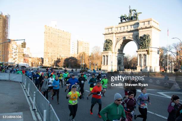 Participants run through Grand Army Plaza during the United Airlines NYC Half on March 17, 2019 in New York City.