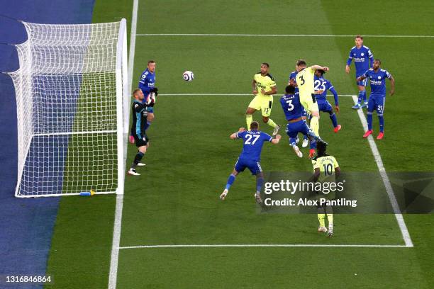 Paul Dummett of Newcastle United scores his team's second goal past Kasper Schmeichel of Leicester City during the Premier League match between...