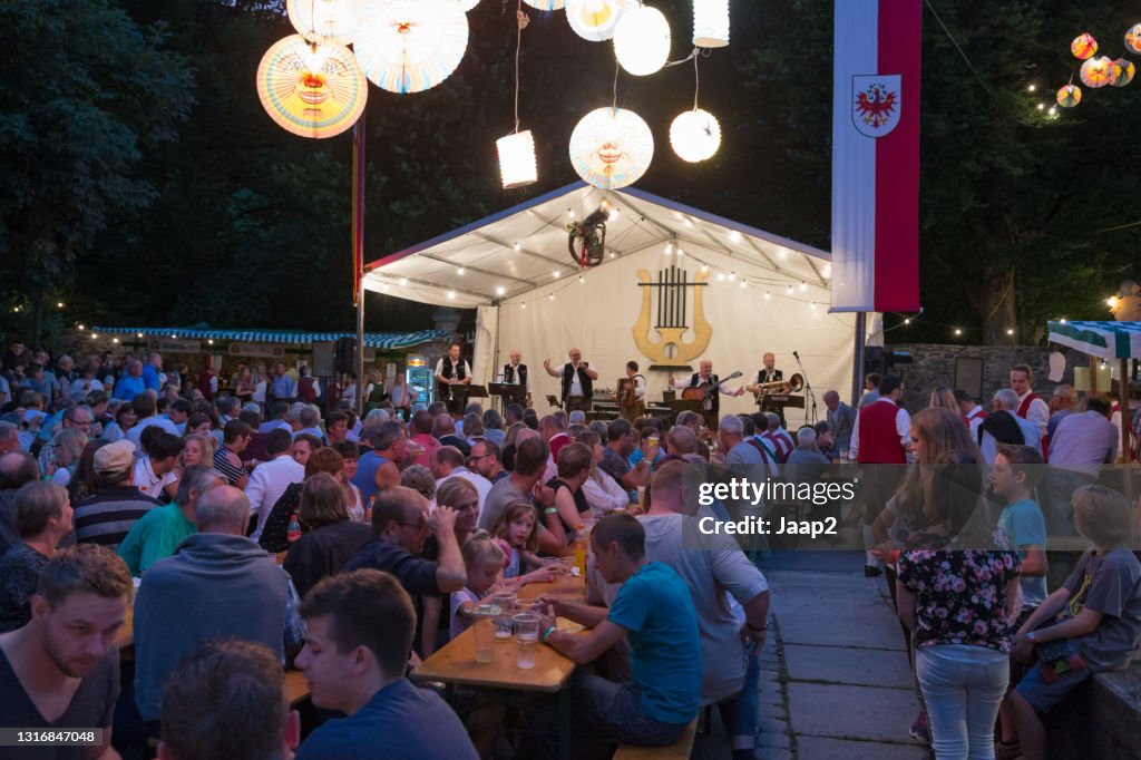 Crowd of people celebrating the annual festivity in the Austrian village of Stumm