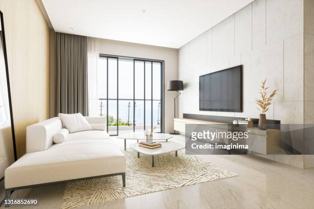 moderne minimalistische woonkamer - tv on wall stockfoto's en -beelden