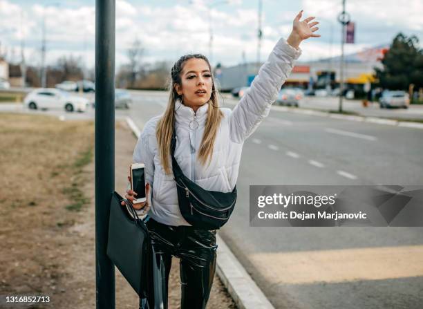 waiting for bus - bus bench stock pictures, royalty-free photos & images