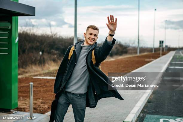 waiting for bus - waiting bus stock pictures, royalty-free photos & images