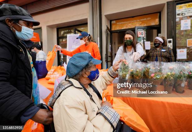 Volunteers with Food Bank for New York City distributes personal hygiene, childcare essentials to families in need for Mother's Day on May 07, 2021...