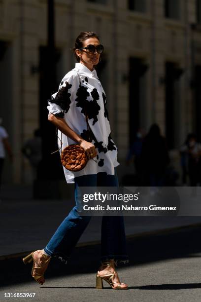 Nieves Alvarez wears Valentino trousers and shirt, Aquazzura shoes and Missoni glasses on May 07, 2021 in Madrid, Spain.