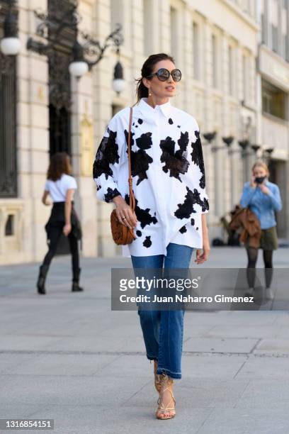Nieves Alvarez wears Valentino trousers and shirt, Aquazzura shoes and Missoni glasses on May 07, 2021 in Madrid, Spain.