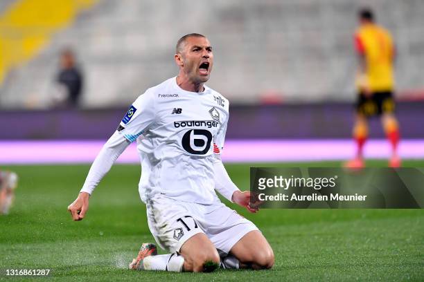 Burak Yilmaz of Lille OSC reacts after scoring his second goal during the Ligue 1 match between RC Lens and Lille OSC at Stade Bollaert-Delelis on...