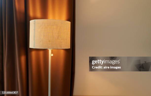 an illuminated lamp in a room - bedroom night stock pictures, royalty-free photos & images
