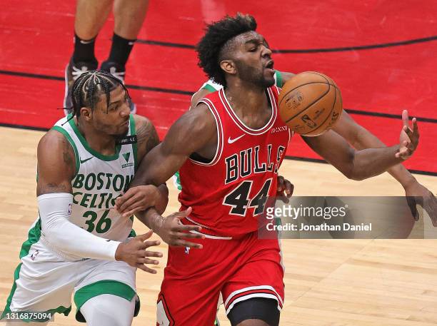 Patrick Williams of the Chicago Bulls is fouled by Marcus Smart of the Boston Celtics at the United Center on May 07, 2021 in Chicago, Illinois. NOTE...