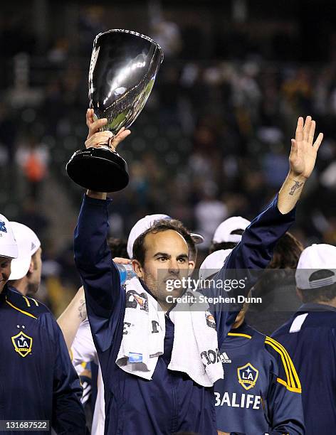 Landon Donovan of the Los Angeles Galaxy holds up the Western Conference trophy after playing Real Salt Lake in the MLS Western Conference...