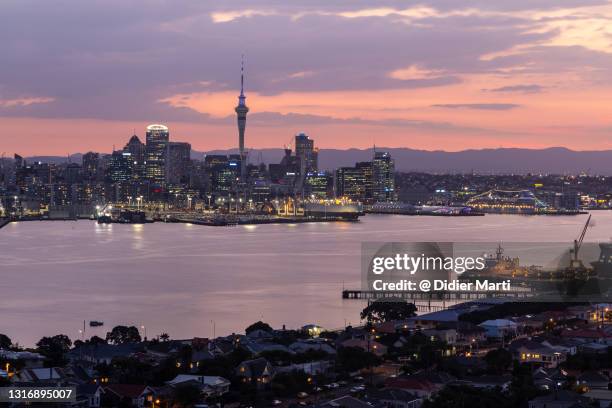twilight over auckland city famous skyline in new zealand - devonport auckland stock pictures, royalty-free photos & images