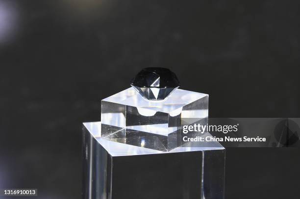 The Korloff Noir, a black diamond weighing 88 carats, is on display during the first China International Consumer Products Expo at Hainan...
