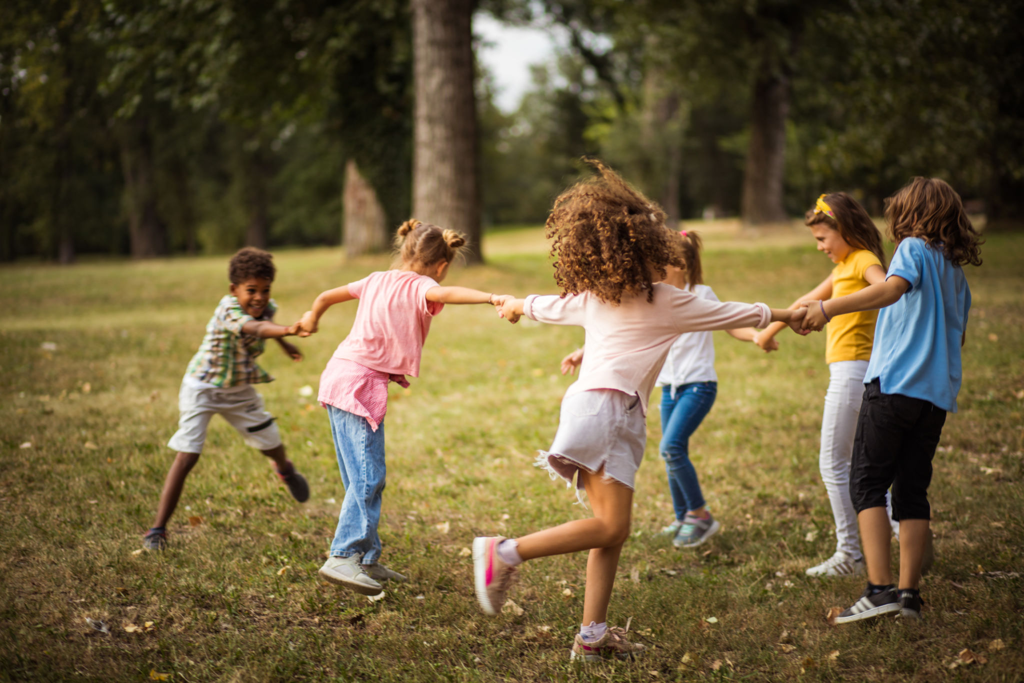 Large group of school kids having fun in nature. Large group of school kids having fun in nature.