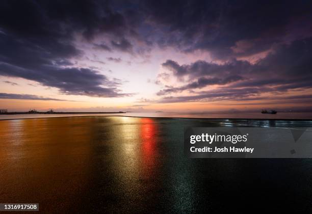 seaside parking lot - wet asphalt stock pictures, royalty-free photos & images