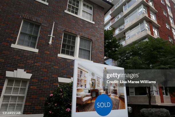 Sold' real estate sign is seen outside a high-rise apartment block in the suburb Kirribilli on May 08, 2021 in Sydney, Australia. Property prices...