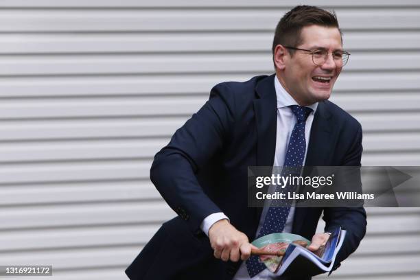 Auctioneer Jesse Davidson counts down a bid during an auction of a residential property in the suburb of Strathfield on May 08, 2021 in Sydney,...