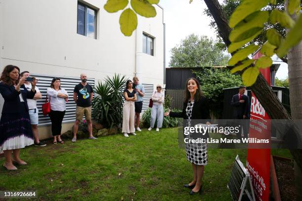 Auctioneer Karen Harvey counts down a bid during an auction of a residential property in Hurlstone Park on May 08, 2021 in Sydney, Australia....