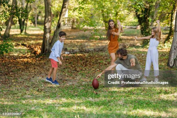 Playing Rugby Outside 36 Boy Kicking A Rugby Ball Stock Photos, High-Res Pictures, and Images ...