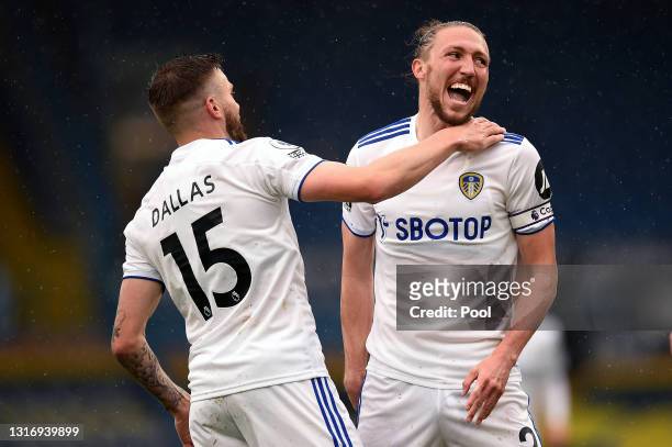 Stuart Dallas of Leeds United celebrates with Luke Ayling after scoring their side's first goal during the Premier League match between Leeds United...