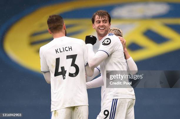 Patrick Bamford of Leeds United celebrates with Mateusz Klich after scoring their side's second goal during the Premier League match between Leeds...