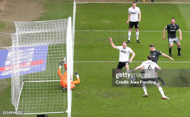 Sam Hutchinson of Sheffield Wednesday scores their side's first goal past Kelle Roos of Derby County during the Sky Bet Championship match between...