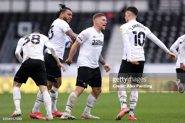 Martyn Waghorn of Derby County celebrates with Colin Kazim-Richards and Tom Lawrence after scoring their side's first goal during the Sky Bet...