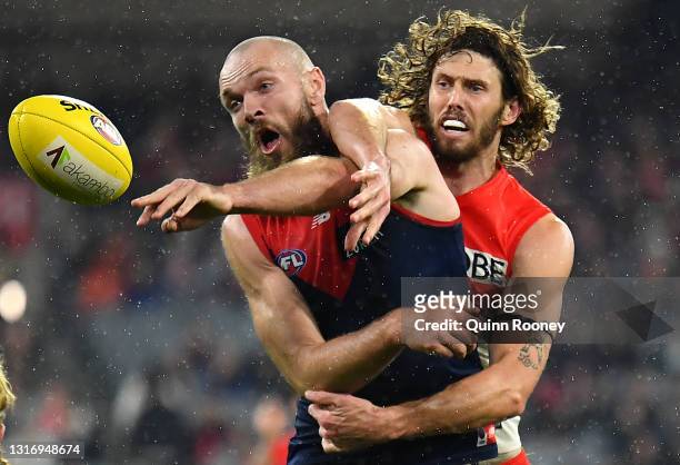 Max Gawn of the Demons and Tom Hickey of the Swans compete in the ruck during the round eight AFL match between the Melbourne Demons and the Sydney...